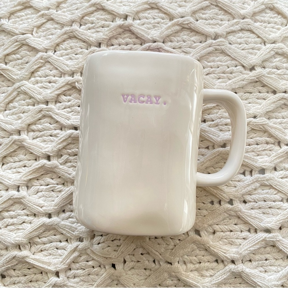 Rae Dunn VACAY typewriter print mug. PURPLE writing and PURPLE inside